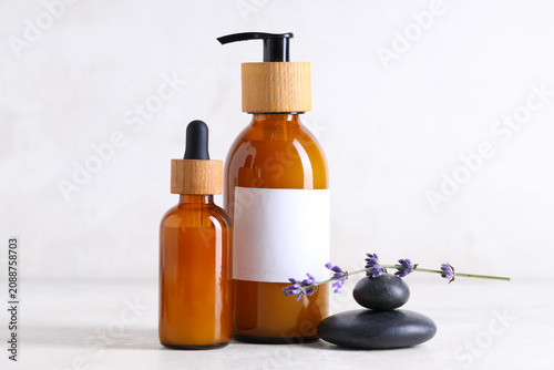 Spa stones and bottles of l...