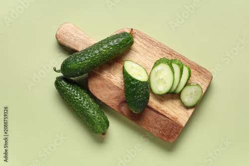 Wooden board with fresh gre...