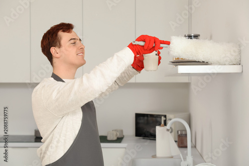Young man with pp-duster cl...
