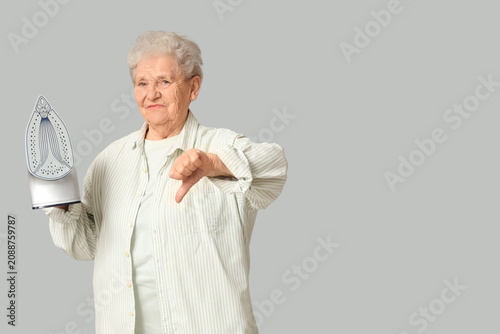 Displeased senior woman wit...