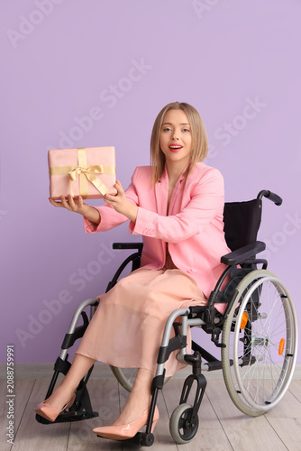 Young woman in wheelchair w...