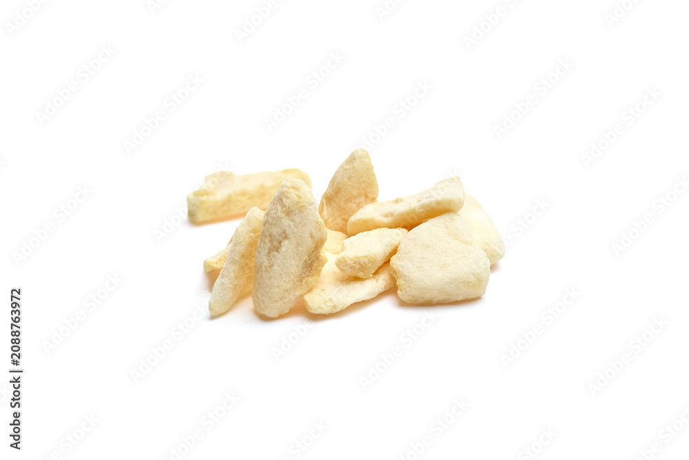 Fototapeta premium Freeze-dried melon fruit crisps arranged on a white background, showcasing their unique texture and shape, ideal for healthy snacking or culinary use