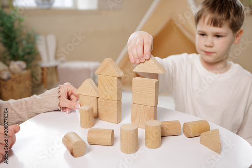 Fotografía Mother and Son Engaging in Logic Games with Wooden Blocks