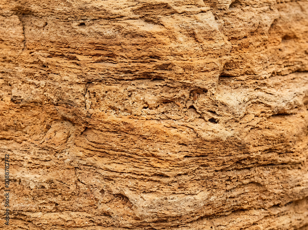 Naklejka premium sandstone texture background, natural layered surface, warm tan orange tone, organic rustic feel, high resolution macro detail, commercial stock photo