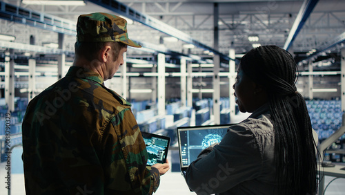 Cuadro en lienzo Army commander and software developer in a military data center use radar software on laptop to monitor missile tracking, enemy threats and aerial activity