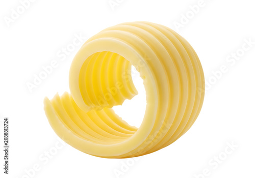 A single, perfectly formed swirl of fresh yellow butter with visible ridges and a smooth texture, isolated on a white background, for food isolated on a transparent background