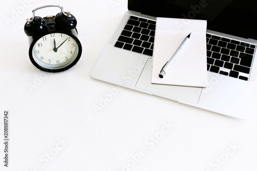 Time Management Workspace with Blank Keyboard and Alarm Clock