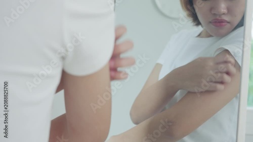 skin problem and beauty. Young woman scratch body has itchy skin from skin allergic, steroid allergy, sensitive skin, red from sunburn, chemical allergy, rash, insect bites, Seborrheic Dermatitis.