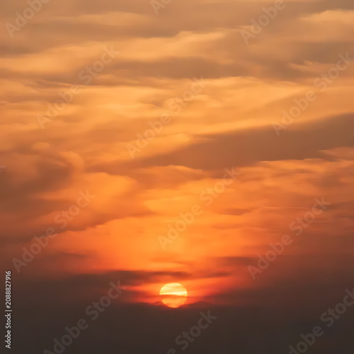 Sunset orange cloudscape with cinematic lighting