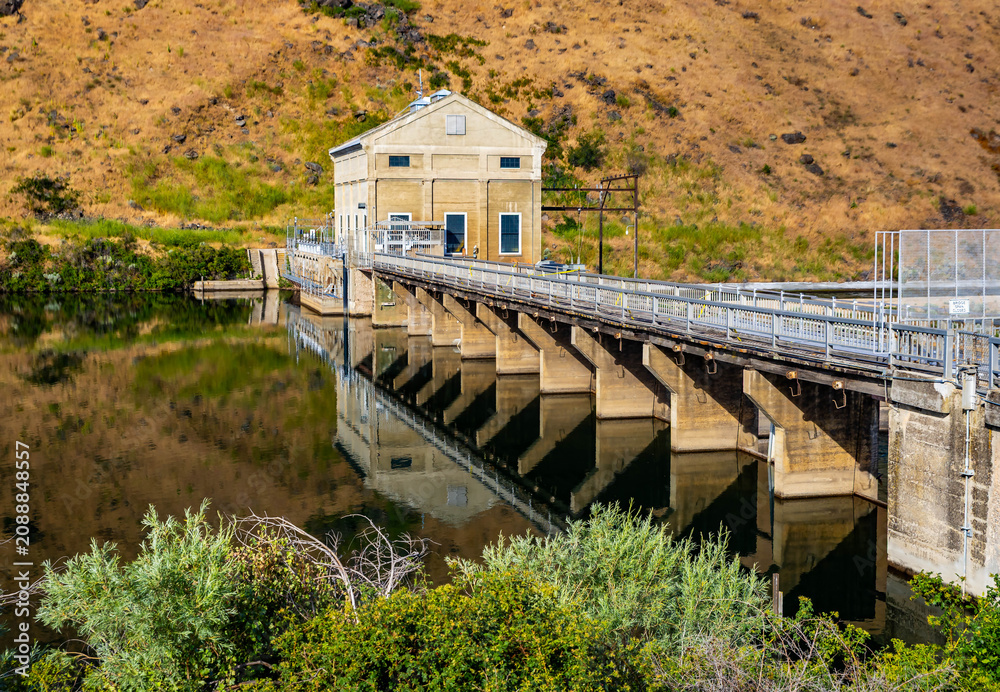 Fototapeta premium Historic Boise River Dam Reflecting in Water
