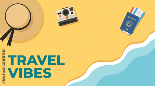 Quadro su tela Travelers' essentials lie on a sunny beach by the ocean with a hat and camera