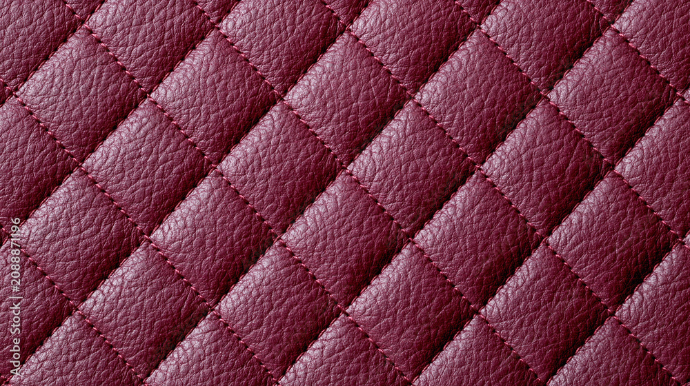 Fototapeta premium Luxurious burgundy quilted leather texture featuring an elegant diamond stitch pattern and rich surface detail