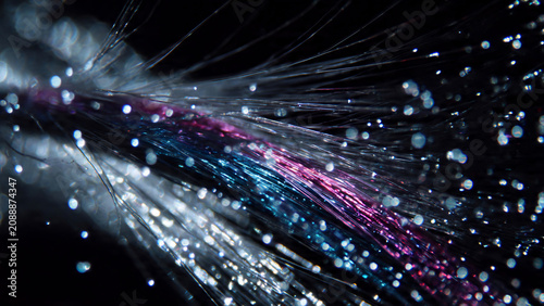 Macro view of vibrant fiber optics with bokeh, showcasing data transmission, perfect for technology blogs, network advertising and digital communication concepts