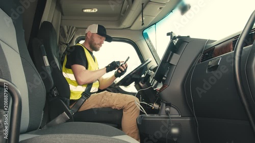 Professional truck driver using smartphone for navigation