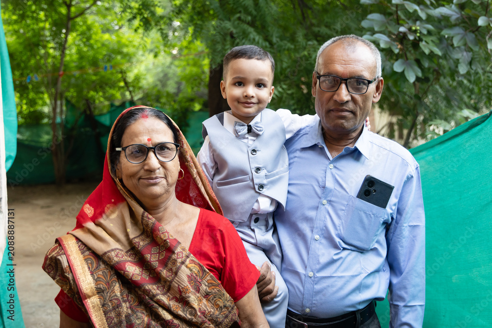 Fototapeta premium affectionate grandparent embracing cheerful child during daytime family celebration