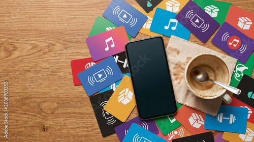 Digital overload workspace with scattered subscription icons and empty coffee cup showing fatigue and distraction in modern lifestyle balance between media and productivity stress