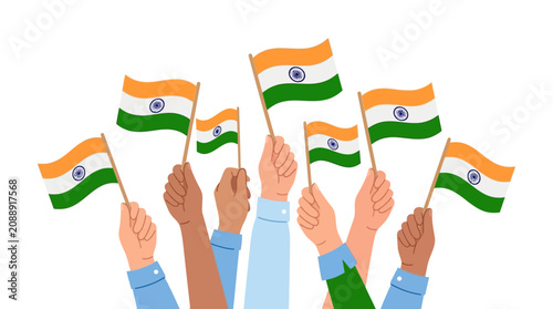 Diverse hands holding Indian flags high in a celebratory gesture.