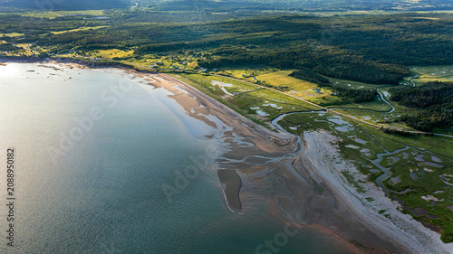 Aerial Drone View of Coastal Estuary, Sandy Beach and Tidal Wetlands at Low Tide