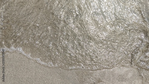 Ocean Wave on Sandy Beach Background with Sea Foam, Tropical Shoreline, Coastal Nature and Summer Travel