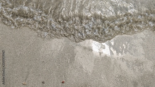 Ocean Wave on Sandy Beach Background with Sea Foam, Tropical Shoreline and Summer Travel