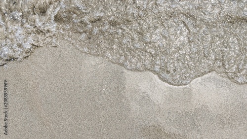 Ocean Wave on Sandy Beach Background with Sea Foam, Tropical Shoreline, Coastal Nature and Summer Travel