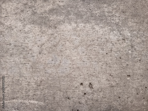 Fotografía Full frame texture of dry weathered concrete surface with fine cracks and rough