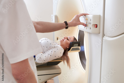 Bild auf Leinwand Female patient undergoing MRI - Magnetic resonance imaging in Hospital