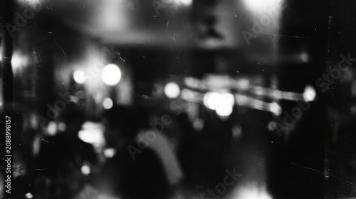 Blurry nightclub scene, dark nightlife, black and white