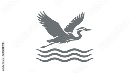 Bild auf Leinwand Grey Heron Flying Over Water Surface.
