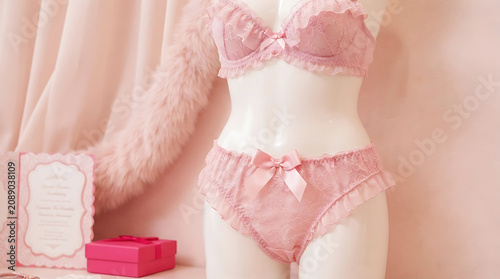 Pink lace bra and panty set on mannequin torso