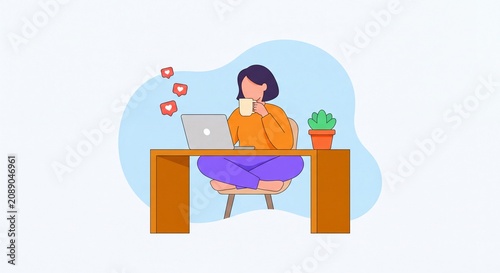 A young woman working remotely on her laptop while sitting cross legged at a wooden desk and drinking a warm beverage in a relaxed home office setting