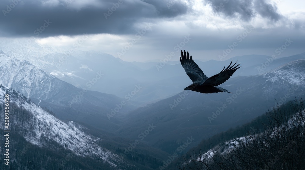 Fototapeta premium Raven flying over a snowy mountain valley with dark clouds above