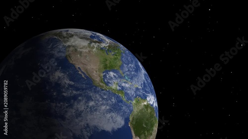 Earth planet rotating in space with galaxy background.