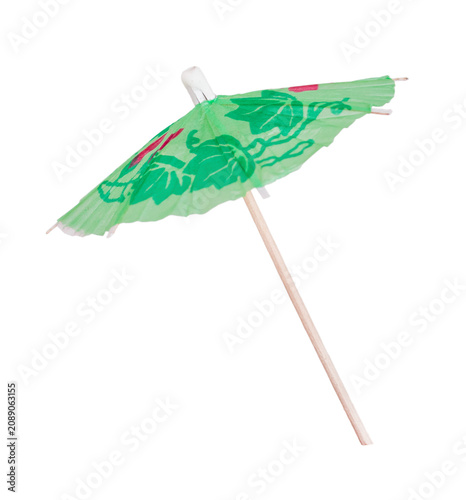 Small green cocktail paper umbrella decoration isolated on white background