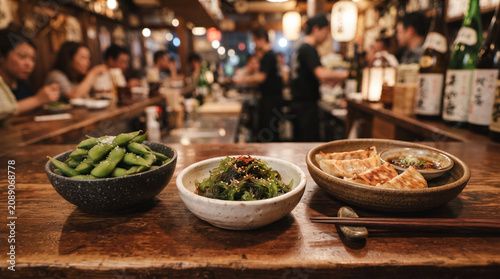 A variety of authentic Japanese appetizers served on rustic wooden tables in the restaurant.