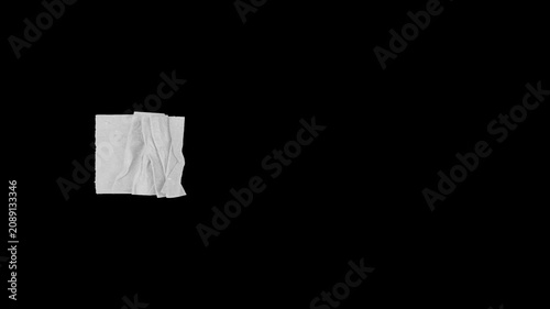 Animated torn paper strip on a black screen background, crumpled paper texture reveal, stop motion collage element with alpha channel.