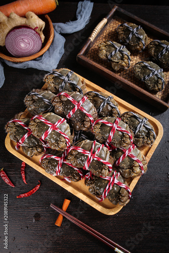 Fresh Yangcheng Lake Hairy Crabs from Suzhou China Tied with Red Ribbons in Wooden Trays Traditional Chinese Seafood Delicacy