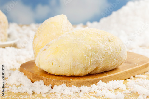 Frozen Durian with Golden Flesh on Wooden Board and Crushed Ice