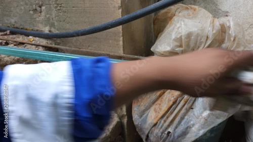 Wiping clean smooth metal profile surface with thinner soaked cotton