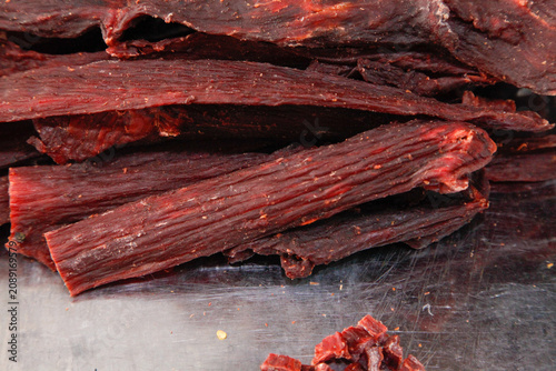 Traditional Homemade Beef Jerky Strips - Dried Meat Snack with Artisanal Craftsmanship and Rich Chewy Texture