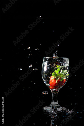 A A strawberry fell into a glass of fresh water. fell into a glass of fresh water.