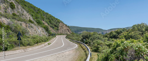 SS 126 bending road  in hilly countryside at Bidderdi pass, near Arbus,  Sulcis Iglesiente, Italy