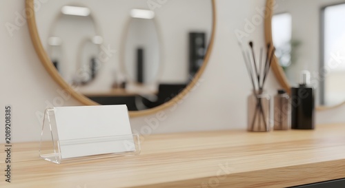 Blank white name card holder on wooden table in modern hair salon with blurred background.