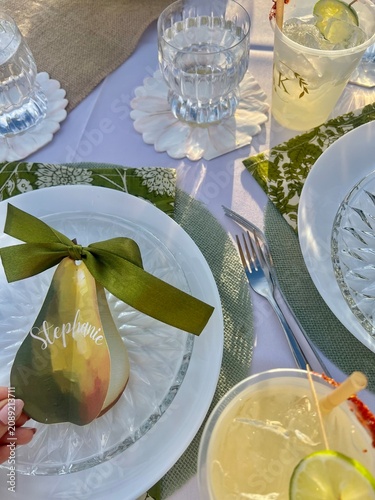 фотографія Elegant Outdoor Table Setting With Personalized Pear Place Card, Glassware And C