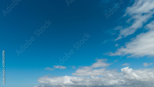 Εκτύπωση καμβά Sunny background, blue sky with white cumulus clouds