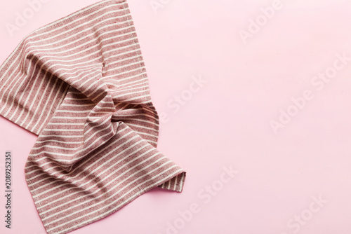 Tableau sur toile top view with red empty kitchen napkin isolated on table background