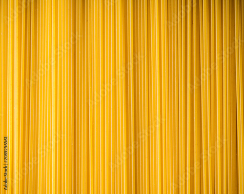 Dry spaghetti as textured background. Shot from above. Background and textures.
