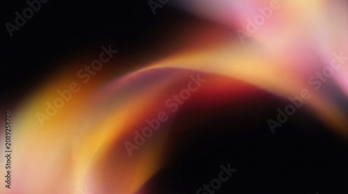 Abstract retro gradient light leak effect with soft blurred luminous overlays flowing across a pure black background.