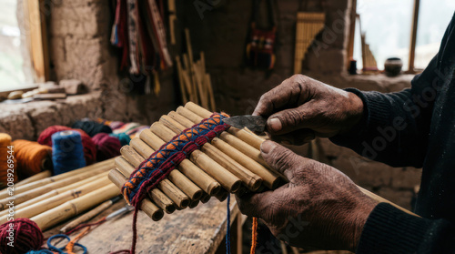 Artisan hands crafting a traditional Andean pan flute musical instrument.