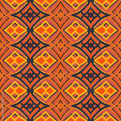 Seamless ethnic ikat pattern with intricate orange, coral pink, and navy blue geometric diamond motifs. Detailed tribal design perfect for bohemian fabric prints, wallpaper, and creative decor.